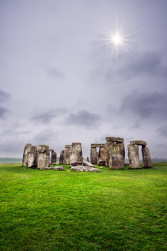 Sun peaking through the stormy clouds, Stonehenge, England