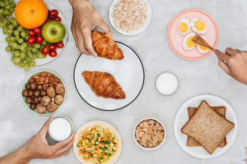 Healthy breakfast ingredients on black concrete background. Oat flakes, almond milk, nuts, fruits and berries. Healthy lifestyle, dieting, healthy eating concept