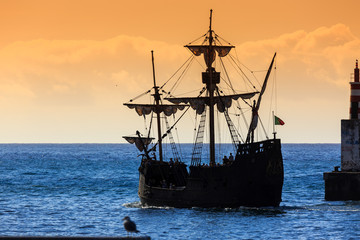 Beautiful silhouette view of a pirate ship sailing around Madeira island in summer, a popular tourist attraction