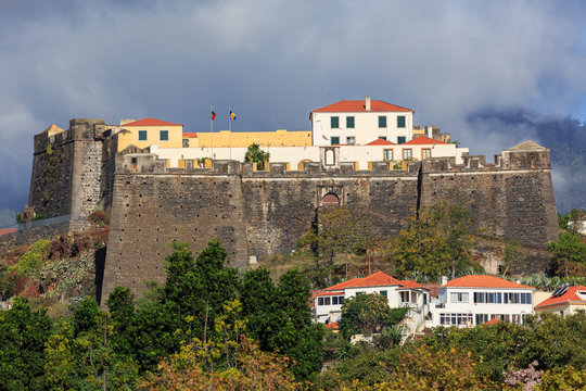 Beautiful view of fort Fortaleza de Sao Joao Baptista do Pico in Funchal, Madeira, on a cloudy summer day © dennisvdwater