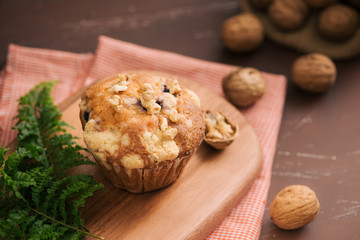 Tasty homemade walnut muffins on table. Sweet pastries