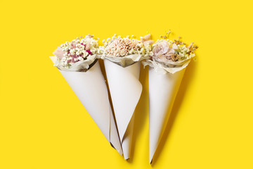 Flowers composition. Frame made of dried flowers on yellow background. conceptual photo of dried flowers 