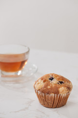Breakfast with fresh homemade delicious muffins and tea.