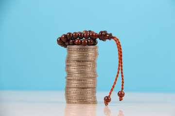coin and rosary 
