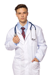 Young medic doctor - serious man in white gown with stetoskope