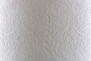 Light background. Abstract texture of vinyl wallpaper on the wall.