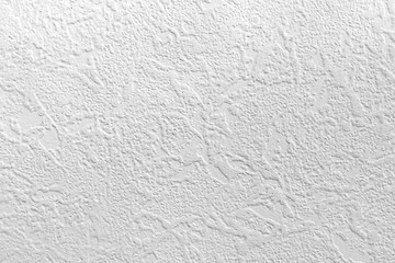 Light background. Abstract texture of vinyl wallpaper on the wall