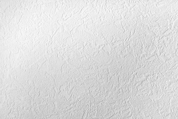 Light background. Abstract texture of vinyl wallpaper on the wall