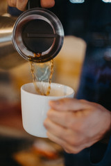 hand with a glass of wine