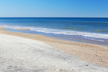 Ocean waves and sand along the beach at Little Talbot Island State Park near Jacksonville, Florida