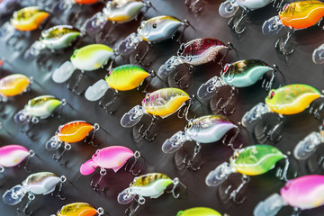 different in color and size fishing lures and baits on the table