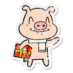 distressed sticker of a nervous cartoon pig with present
