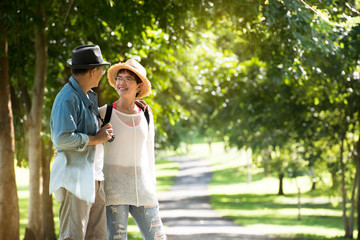 Image of happy romantic Asian senior couple outdoor in park