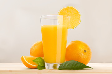 glass of orange juice and fruits