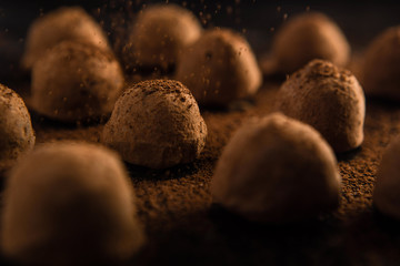 chocolate truffles on black background