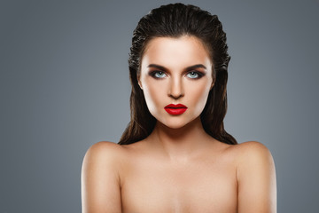 Portrait of beautiful young woman with a red lipstick
