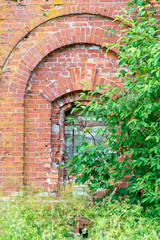 abandoned brick wall with window