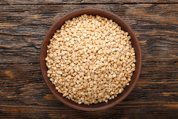 Dried peas in a clay plate. View from above.