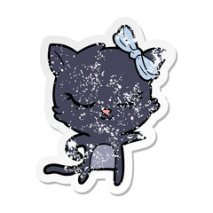 distressed sticker of a cute cartoon cat with bow
