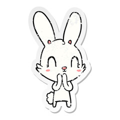 distressed sticker of a cute cartoon rabbit