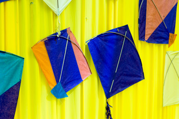 Indian handmade kites mounted on a fabric wall for decor 