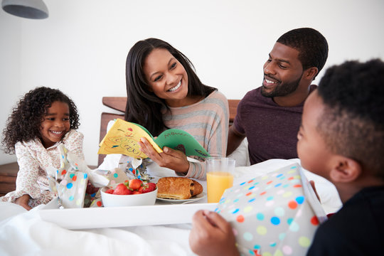 Children Bringing Mother Breakfast In Bed To Celebrate Mothers Day Or Birthday