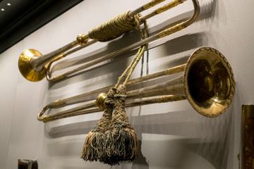 Old bronze trumpet on the wall