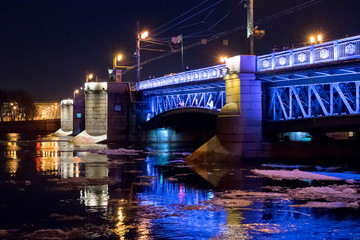 bridge at night in Saint Petersburg under bridge with reflection on water