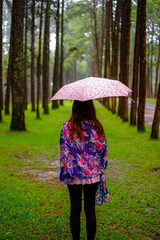 girl with umbrella in jungle
