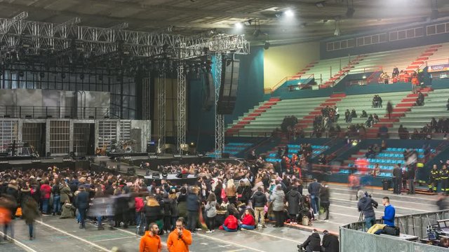 Timelapse sports arena as it fills up with fans before a musical concert