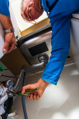 Plumber fixing the basin