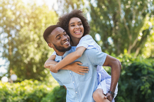 Happy Young Couple Laughing And Having Fun