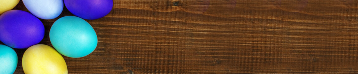 Wooden background with Easter eggs. Concept and happy Easter hol