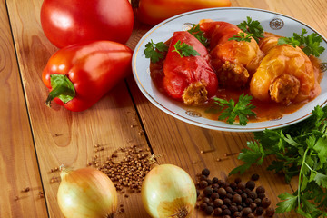 Stuffed peppers: rice with meat and spices in tomato sauce - delicious food.