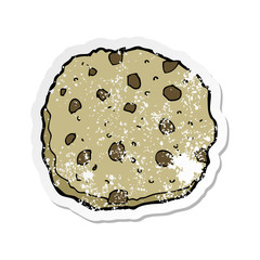 retro distressed sticker of a chocolate chip cookie cartoon