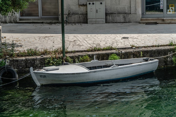 the boat is moored to the pier in the river