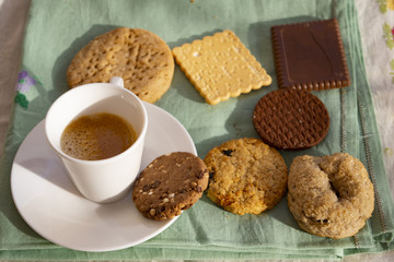 espresso cup with assorted cookies