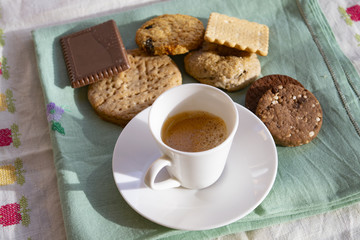 espresso cup with assorted cookies