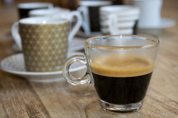 extra strong espresso in glass small cup