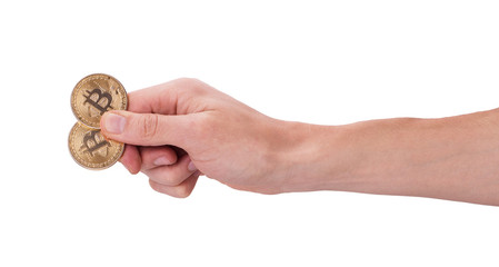 two golden Bitcoin in a man hand. Digitall symbol of a new virtual currency.