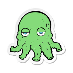 sticker of a cartoon alien squid face