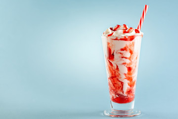 Strawberry milkshake with whipped cream.