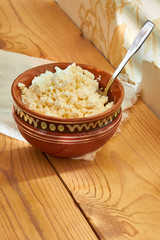 Sources of high-grade protein - cottage cheese, milk, healthy food on the morning table.