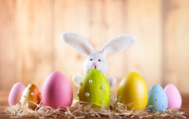 Easter composition with colorful Easter eggs and bunny.