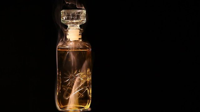 glass perfume smoke dark background nobody hd footage 