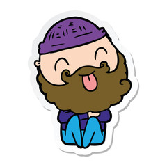 Obraz premium sticker of a man with beard sticking out tongue