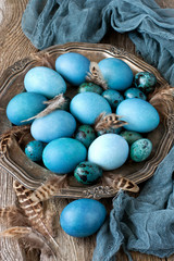 Сolorful Easter eggs on silver plate