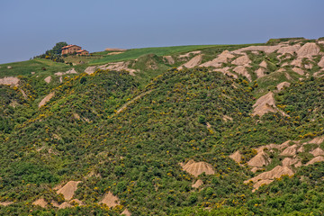 Beautiful view of the hilly landscape of the Crete Senesi. Crete Senesi landscape with Biancane, dome-shaped formations, near Siena, Tuscany, Italy