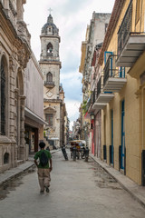 Fototapeta na wymiar Havana, Cuba - 20 January 2013: A view of the streets of the city with cuban people.