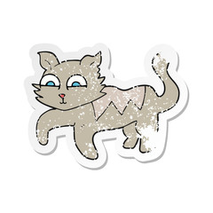retro distressed sticker of a cartoon cat